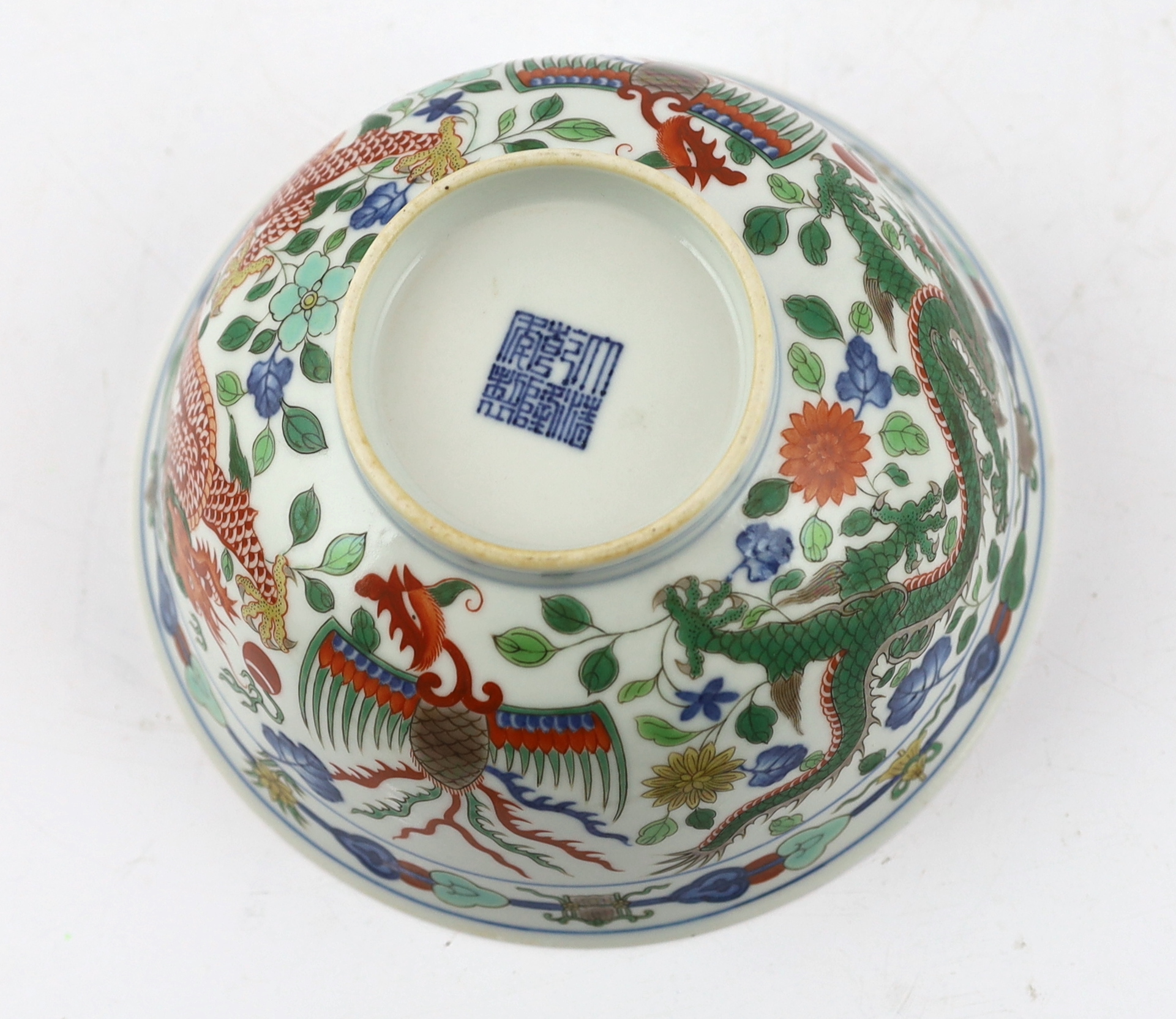 A Chinese wucai ‘dragon and phoenix’ bowl, Qianlong mark and possibly of the period